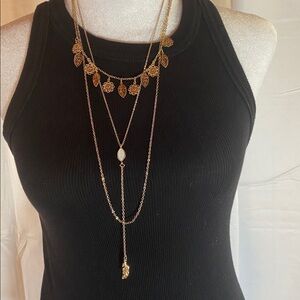 Gold tone layered three tier leaf necklace